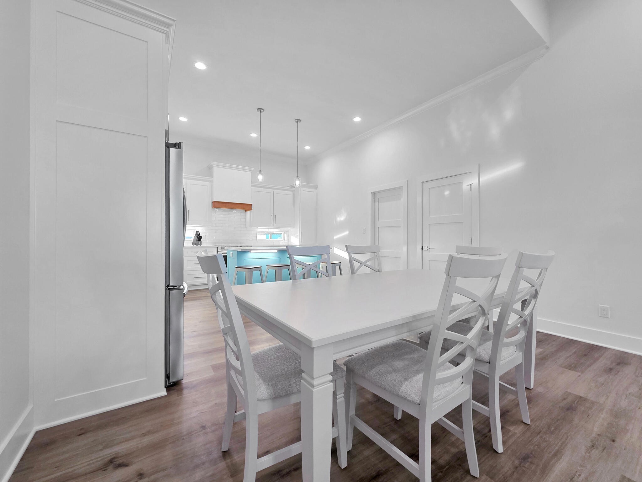 1221 Gulf Road Crystal Beach, TX 77650 - Photo 10 of 48 a view of a dining room with furniture and wooden floor