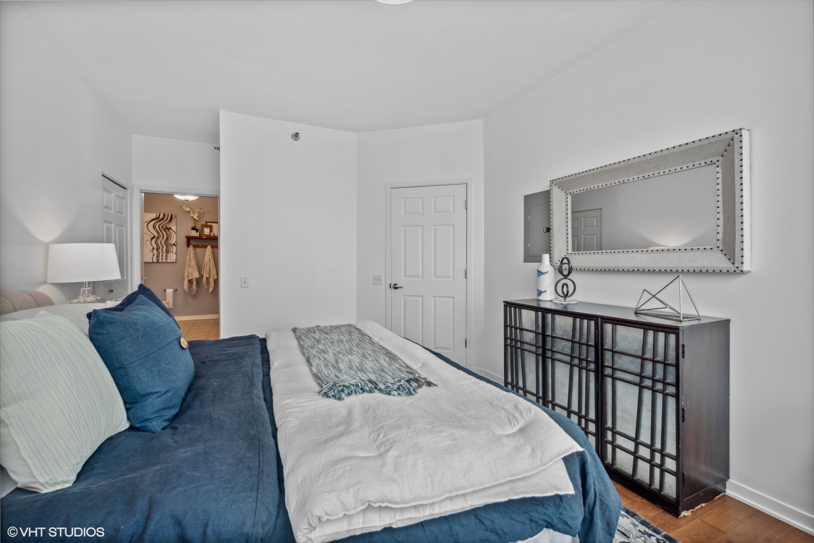 757 North Orleans Street, Unit 1111 Chicago, IL 60654 - Photo 11 of 16 a bedroom with furniture and wooden floor