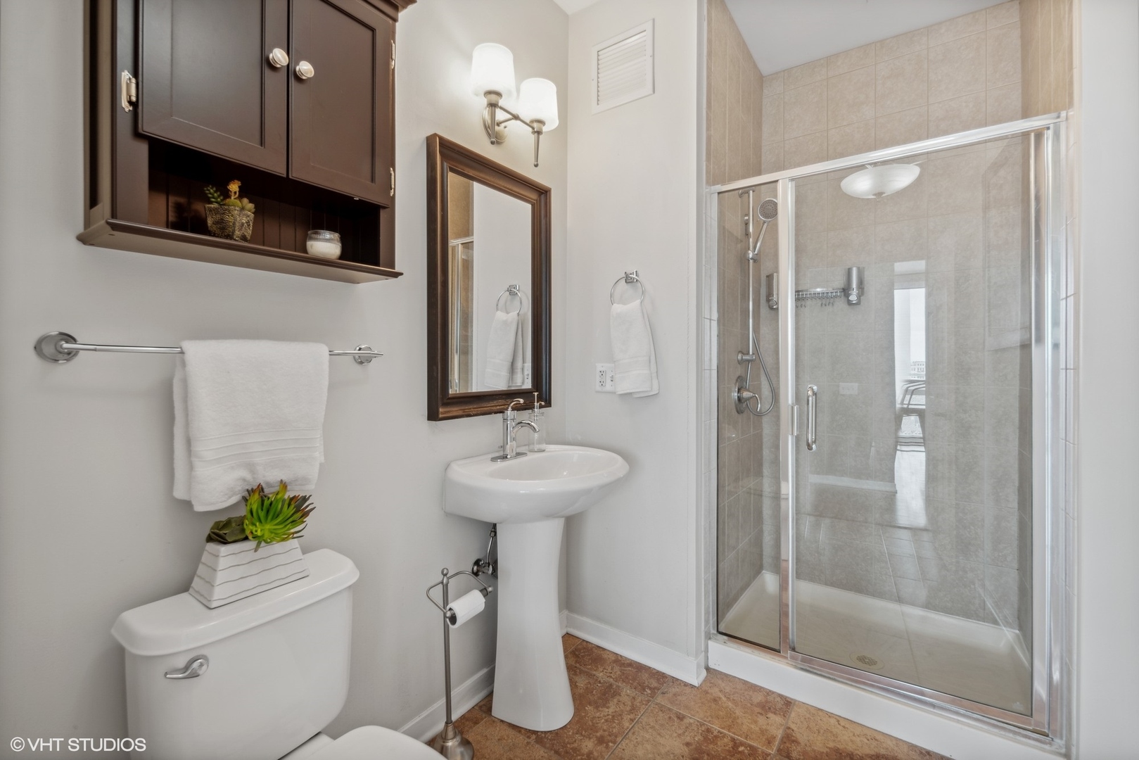 757 North Orleans Street, Unit 1111 Chicago, IL 60654 - Photo 9 of 16 a bathroom with a sink toilet and shower