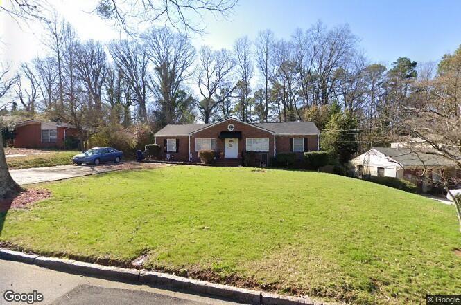 1875 Brewer Boulevard Southwest Atlanta, GA 30310 - Photo 1 of 1 a house view with swimming pool in front of it