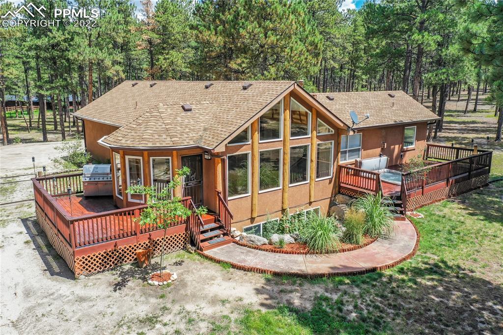 9155 Morgan Road Colorado Springs, CO 80908 - Photo 1 of 41 an outdoor view of house with swimming pool and furniture