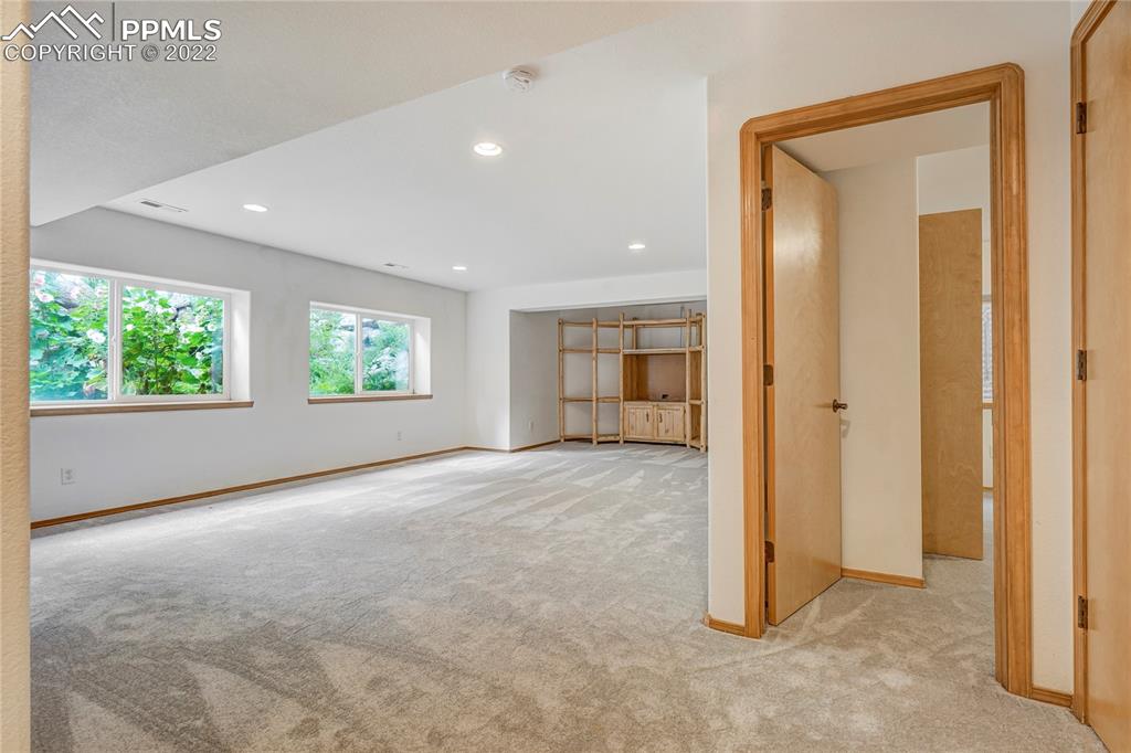 9155 Morgan Road Colorado Springs, CO 80908 - Photo 23 of 41 an empty room with windows and closet