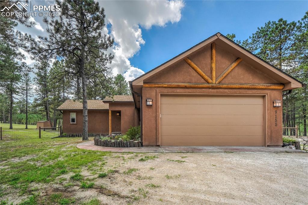 9155 Morgan Road Colorado Springs, CO 80908 - Photo 3 of 41 a front view of a house with garden