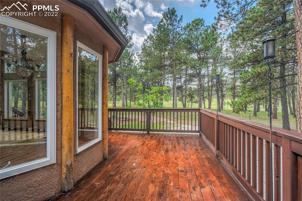 9155 Morgan Road Colorado Springs, CO 80908 - Photo 33 of 41 a view of a balcony with wooden floor