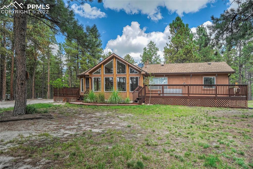 9155 Morgan Road Colorado Springs, CO 80908 - Photo 38 of 41 a view of a house with a yard