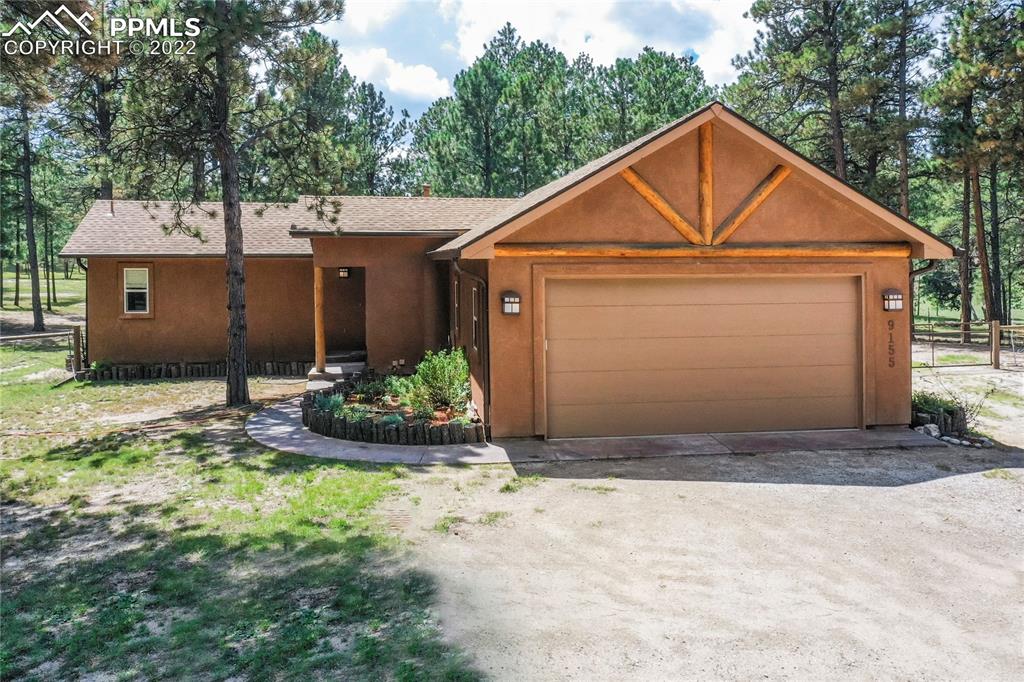 9155 Morgan Road Colorado Springs, CO 80908 - Photo 5 of 41 a front view of house with yard