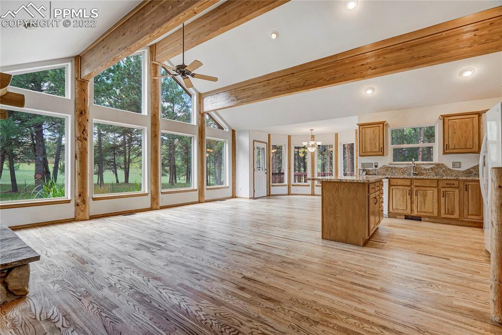 9155 Morgan Road Colorado Springs, CO 80908 - Photo 8 of 41 a view of a kitchen with furniture and floor to ceiling windows