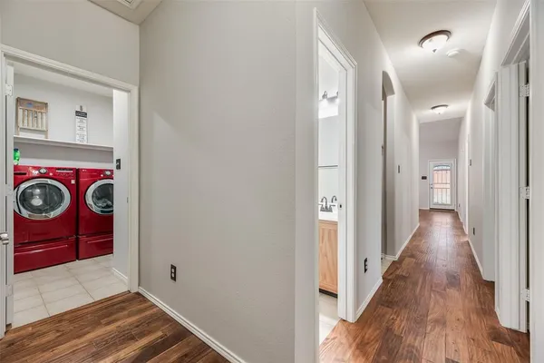 a bathroom with a sink a toilet and shower curtain