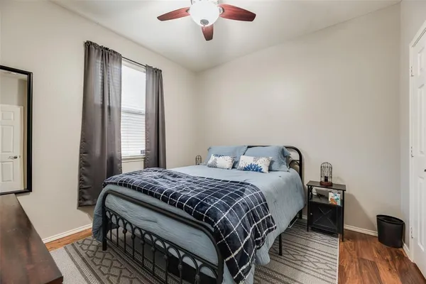 a bedroom with a bed and a view of bathroom