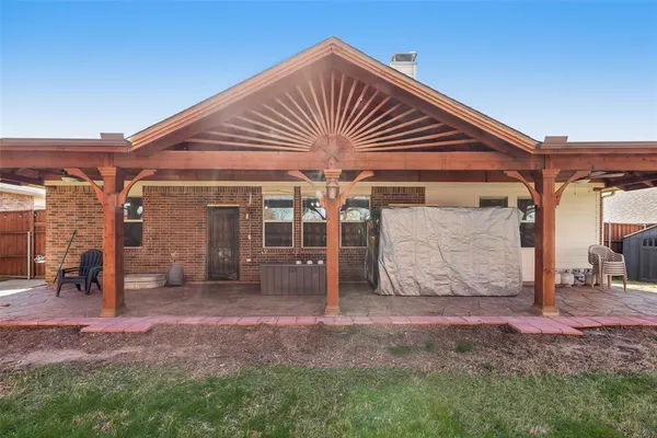 a view of a house with a yard and sitting area