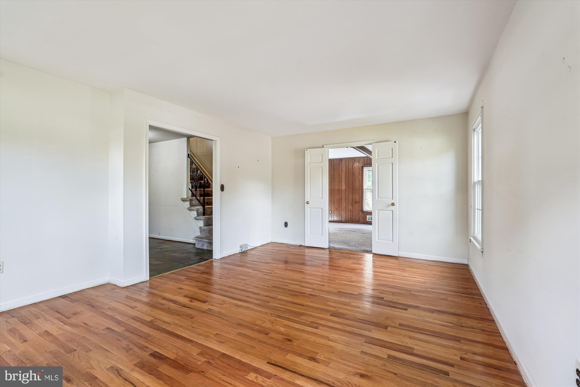 13708 Turnmore Road Silver Spring, MD 20906 - Photo 16 of 65 a view of a big room with wooden floor and windows
