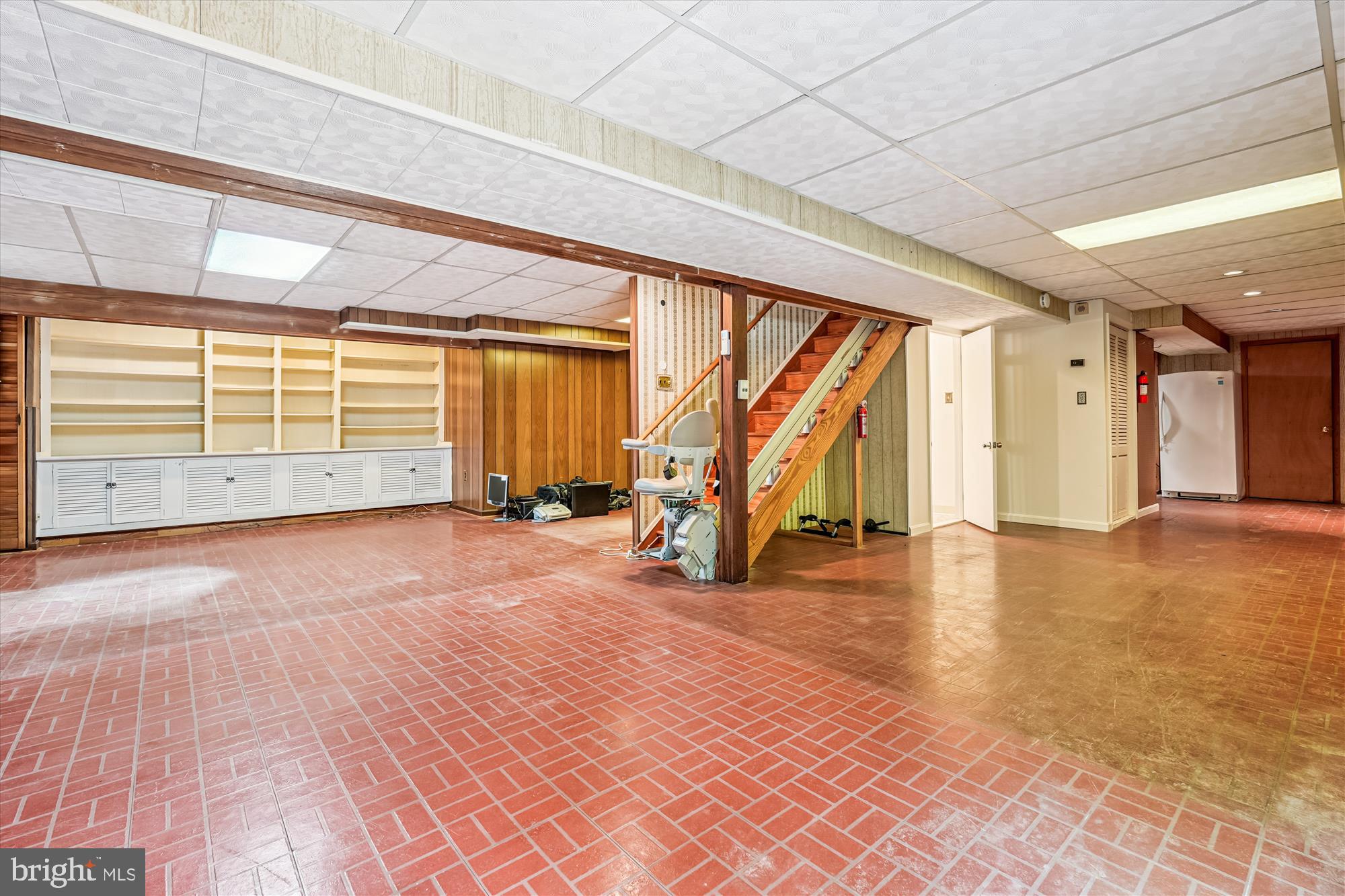13708 Turnmore Road Silver Spring, MD 20906 - Photo 55 of 65 a view of a room with wooden floor and stairs