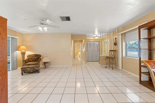 a view of a room with gym equipment and a large window