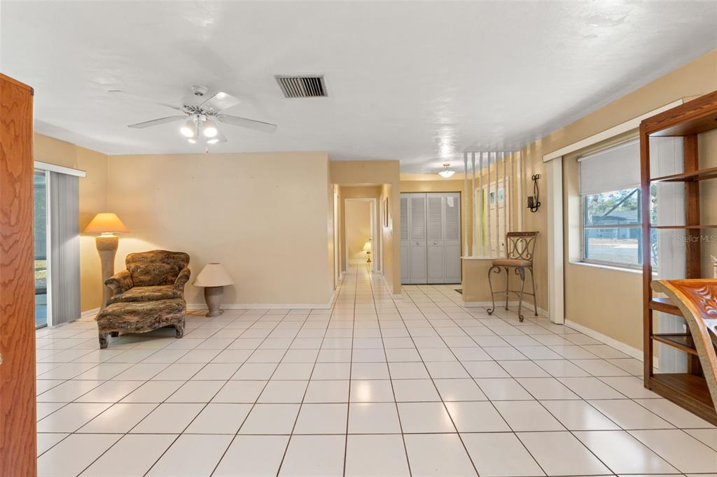 7222 Holiday Drive Spring Hill, FL 34606 - Photo 11 of 50 a view of a room with gym equipment and a large window