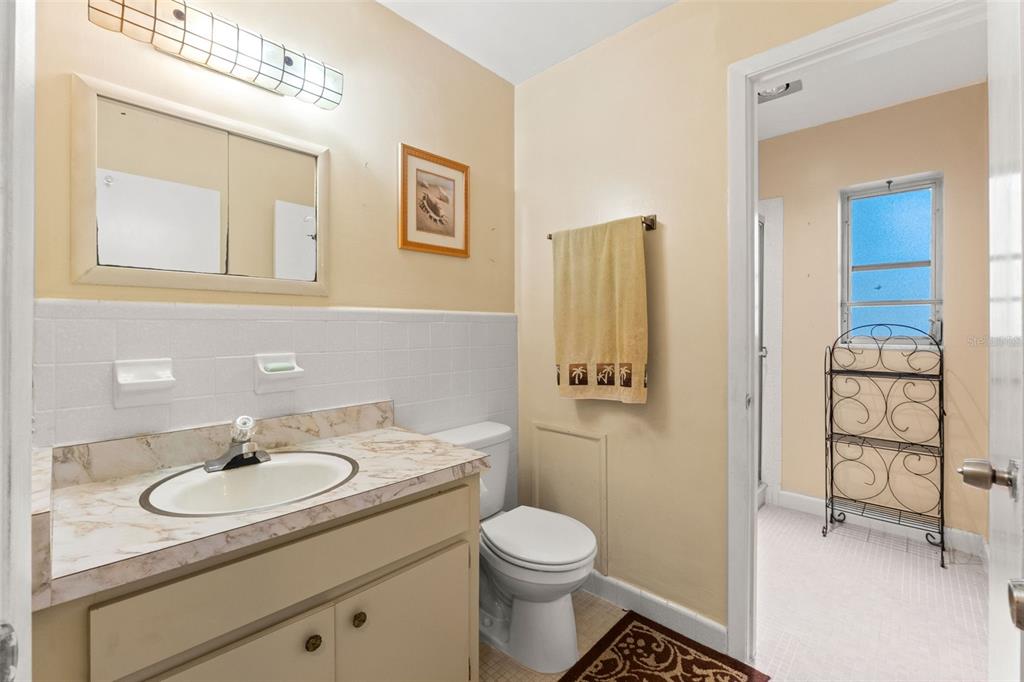 7222 Holiday Drive Spring Hill, FL 34606 - Photo 19 of 50 a bathroom with a sink toilet and shower