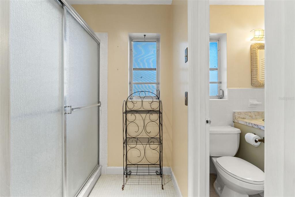 7222 Holiday Drive Spring Hill, FL 34606 - Photo 20 of 50 a bathroom with a toilet and a shower