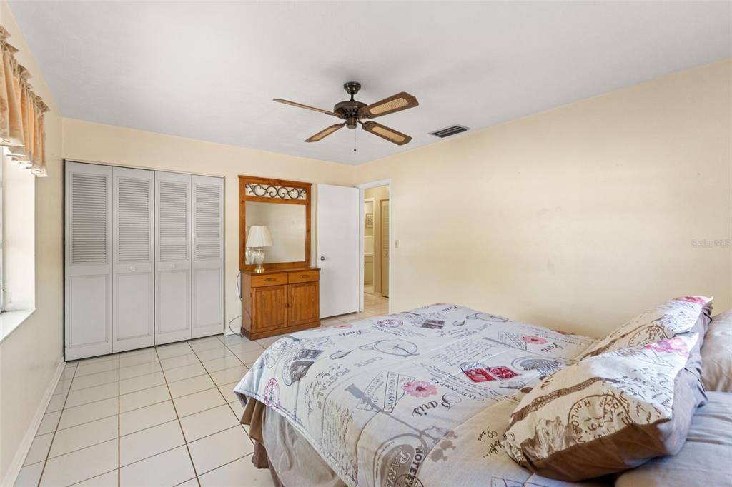 7222 Holiday Drive Spring Hill, FL 34606 - Photo 24 of 50 a bedroom with a bed and a window