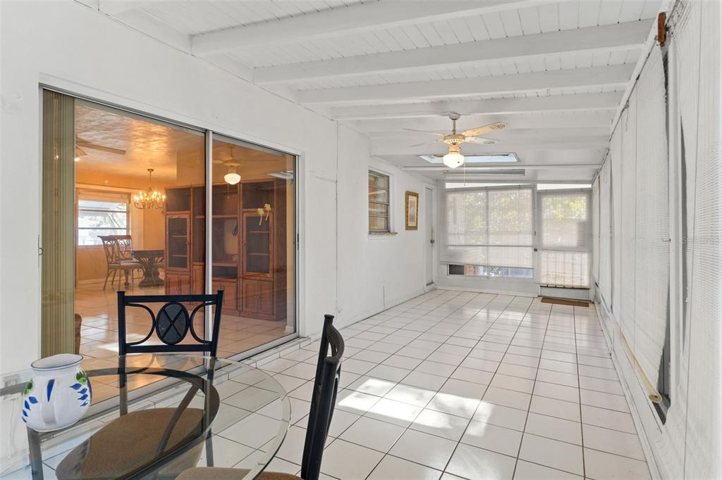 7222 Holiday Drive Spring Hill, FL 34606 - Photo 29 of 50 a view of a room with furniture and floor to ceiling window