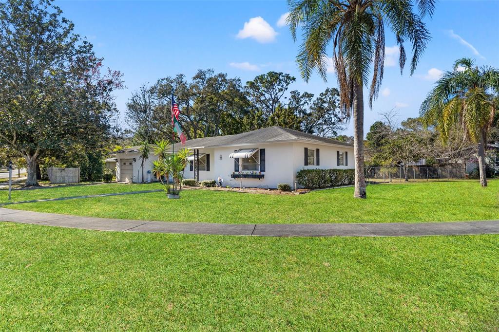 7222 Holiday Drive Spring Hill, FL 34606 - Photo 47 of 50 a front view of house with yard and green space