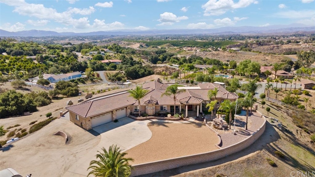 38345 Chaparral Drive Temecula, CA 92592 - Photo 2 of 43 an aerial view of a house with a yard