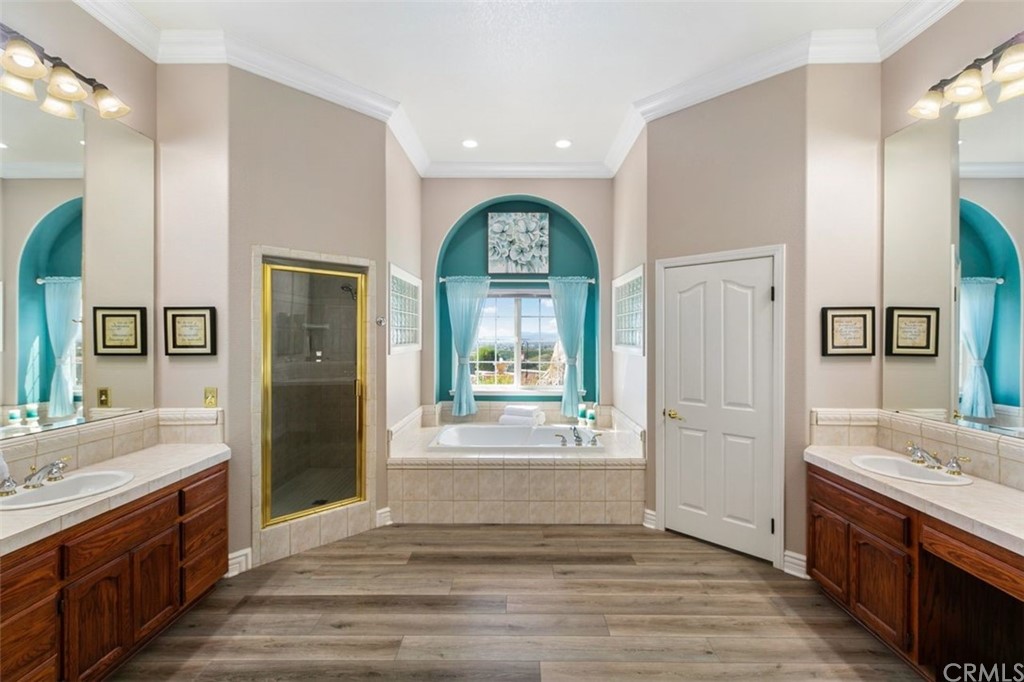 38345 Chaparral Drive Temecula, CA 92592 - Photo 23 of 43 a bedroom with a bed a dresser and flat screen tv