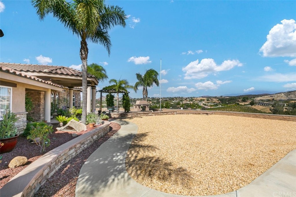 38345 Chaparral Drive Temecula, CA 92592 - Photo 37 of 43 a large house with a large tree and yard