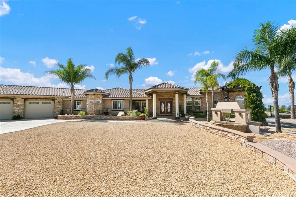 38345 Chaparral Drive Temecula, CA 92592 - Photo 38 of 43 a view of a swimming pool with a table and chairs
