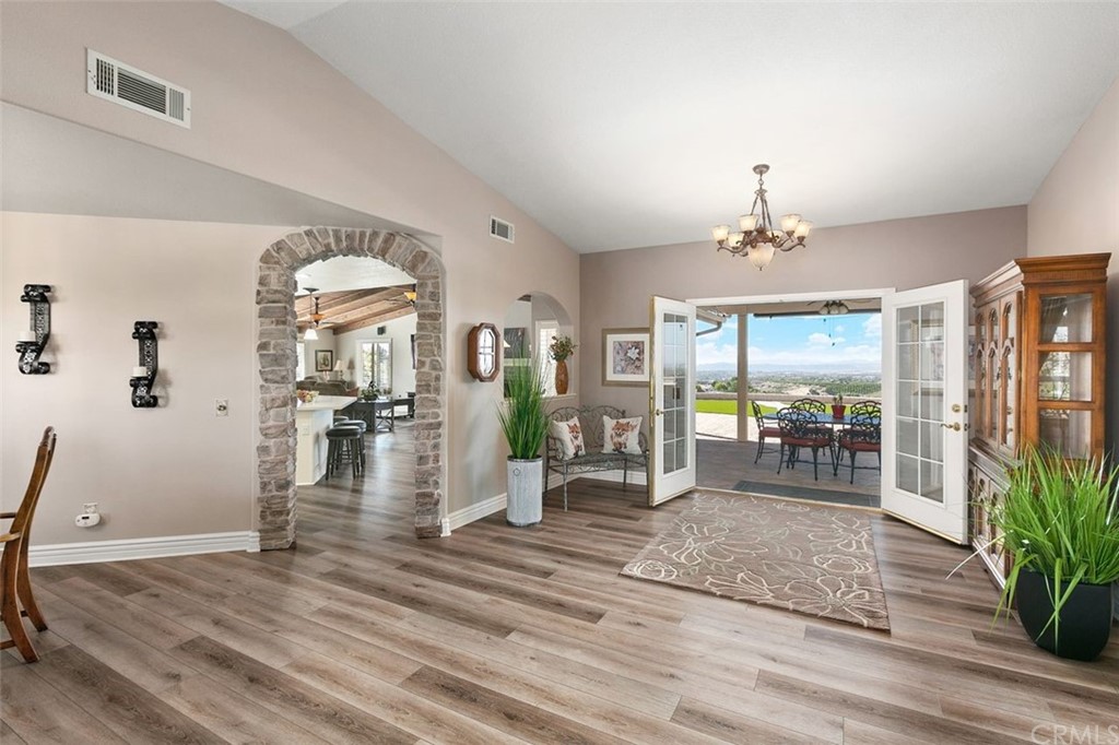38345 Chaparral Drive Temecula, CA 92592 - Photo 5 of 43 a view of a livingroom with furniture wooden floor a chandelier