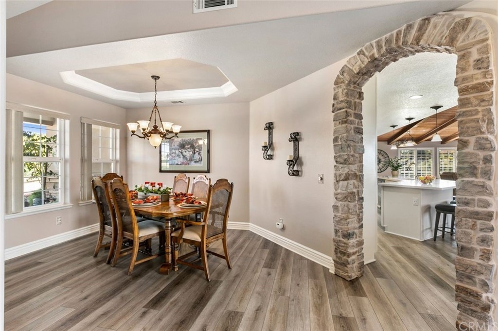 38345 Chaparral Drive Temecula, CA 92592 - Photo 7 of 43 a view of a dining room with furniture window and wooden floor