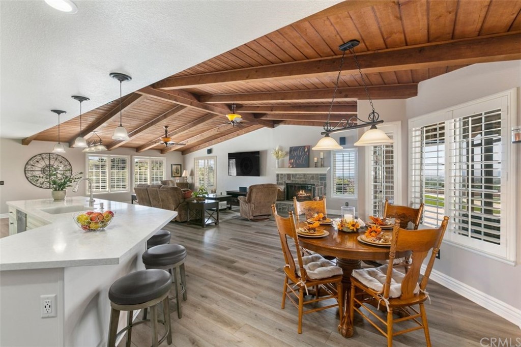 38345 Chaparral Drive Temecula, CA 92592 - Photo 8 of 43 a living room with chairs and a table with wooden floor
