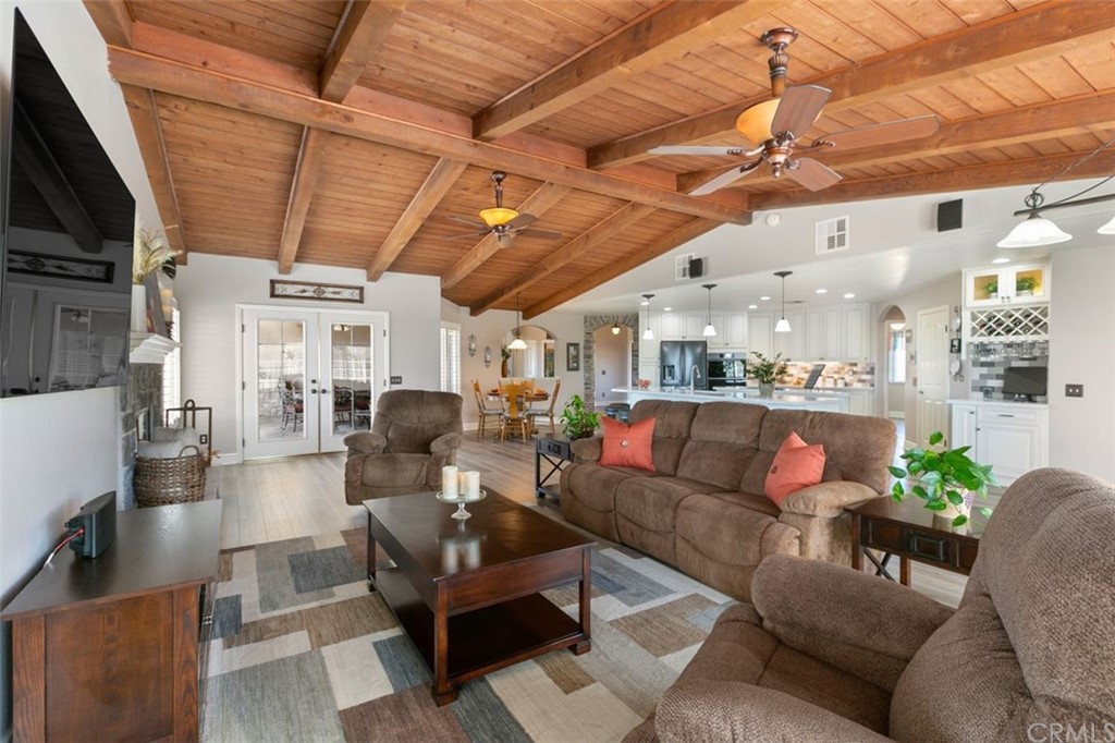 38345 Chaparral Drive Temecula, CA 92592 - Photo 10 of 43 a living room with furniture a flat screen tv and a fireplace