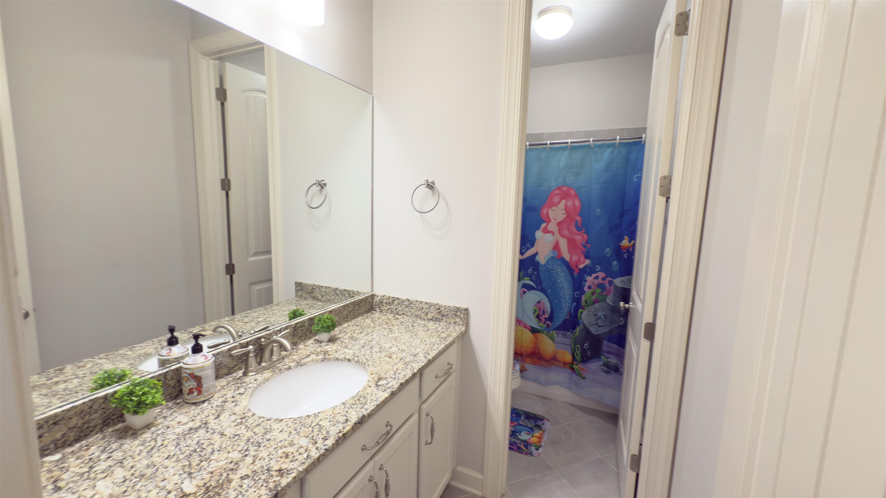 1217 Pilgrim Ridge Road Collierville, TN 38017 - Photo 22 of 33 Bathroom featuring vanity, light tile patterned floors, and a shower with shower curtain
