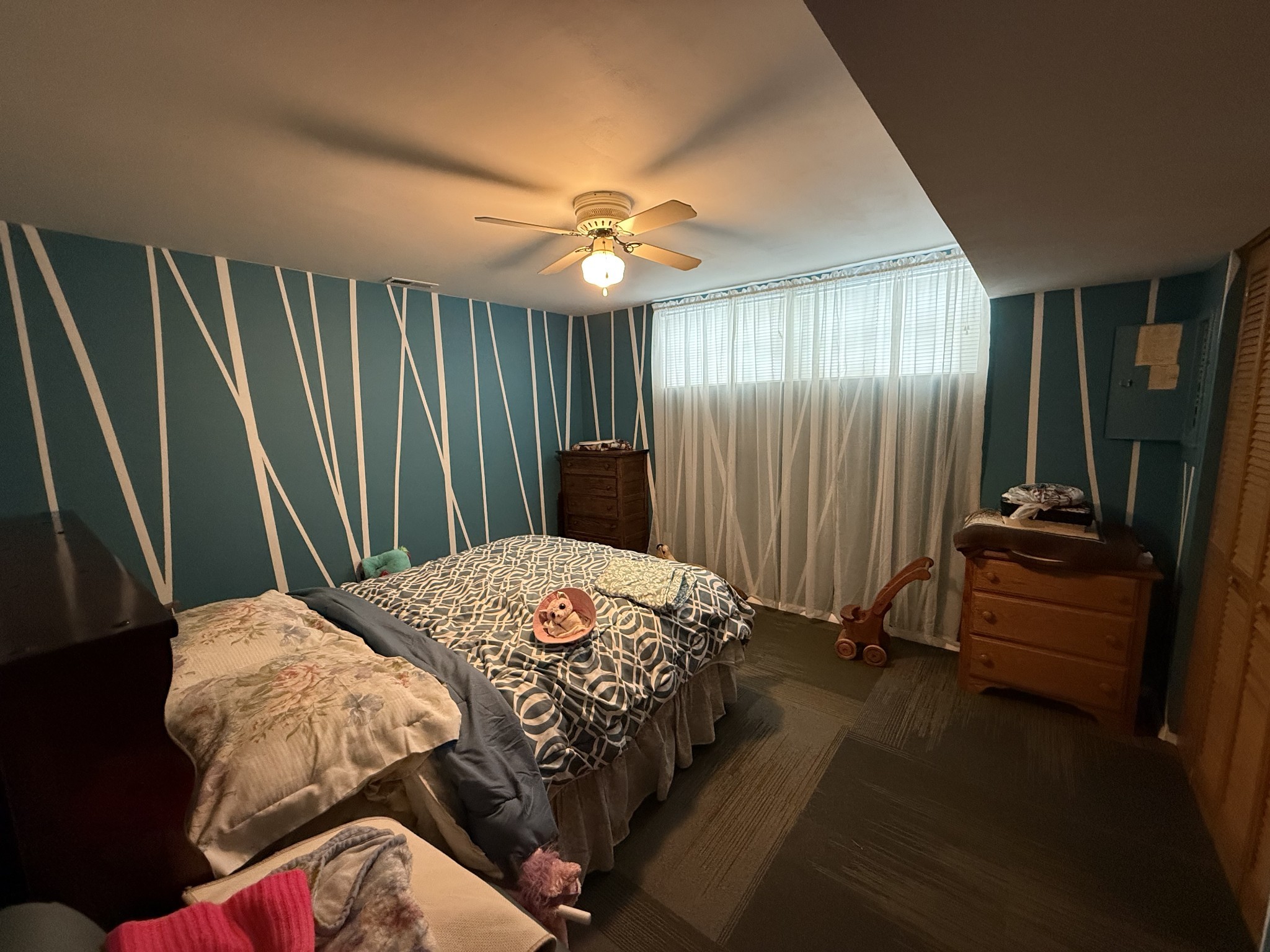 5 Carol Road Summertown, TN 38483 - Photo 12 of 60 a bedroom with a bed and a chandelier