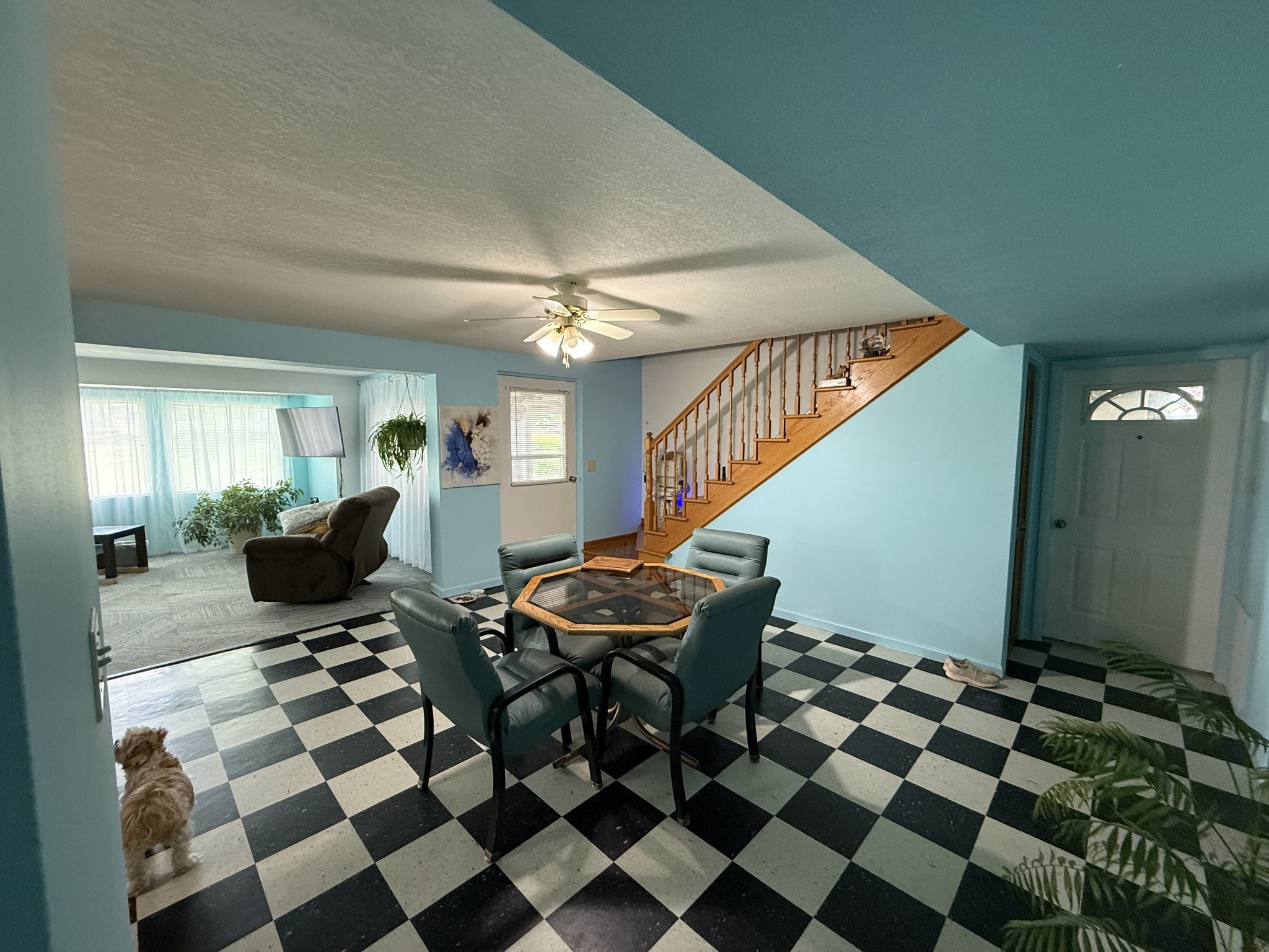 5 Carol Road Summertown, TN 38483 - Photo 15 of 60 a living room with a black white checkered floor with couches chair and a coffee table