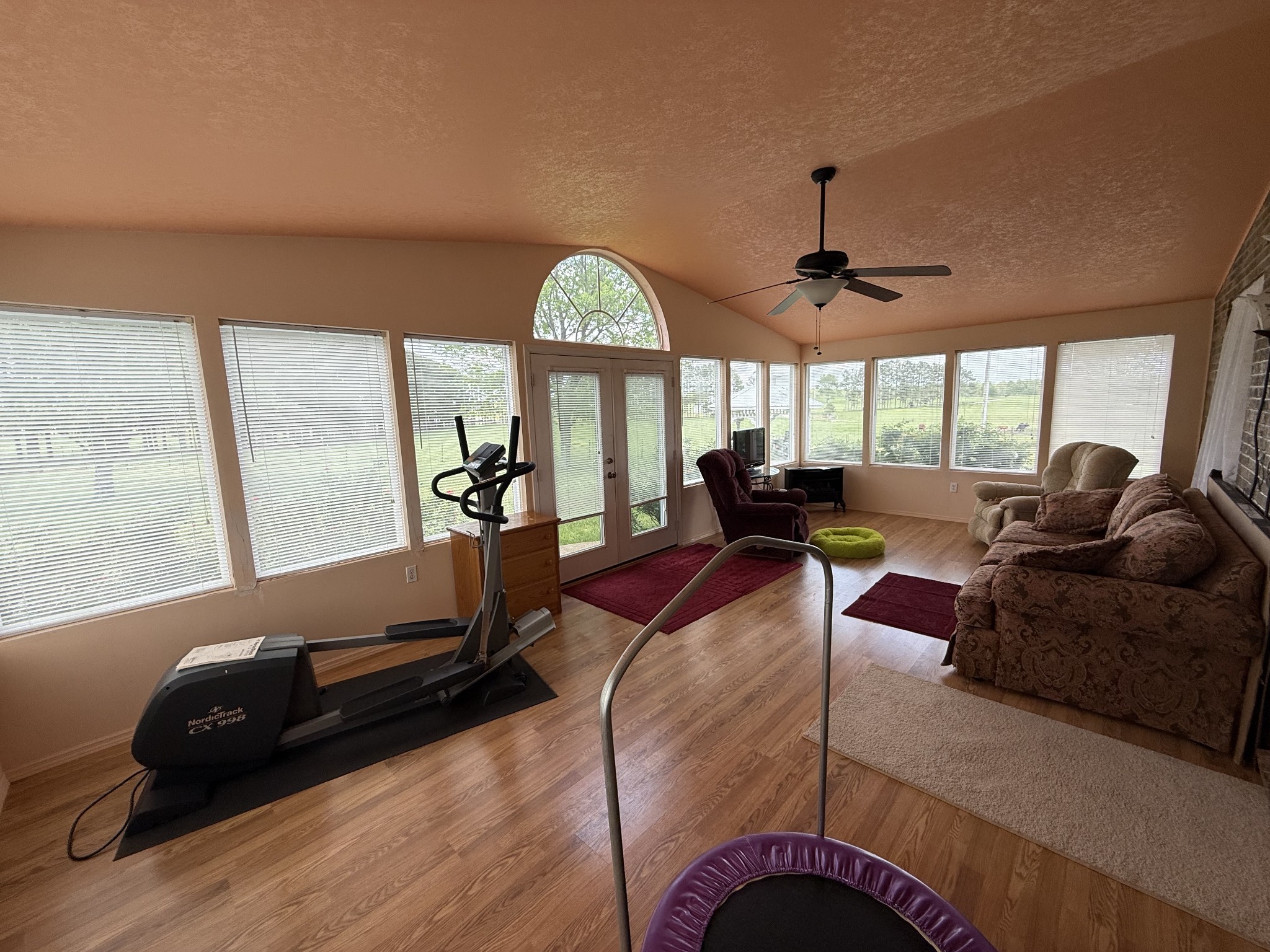 5 Carol Road Summertown, TN 38483 - Photo 26 of 60 a living room with furniture gym equipment and a large window