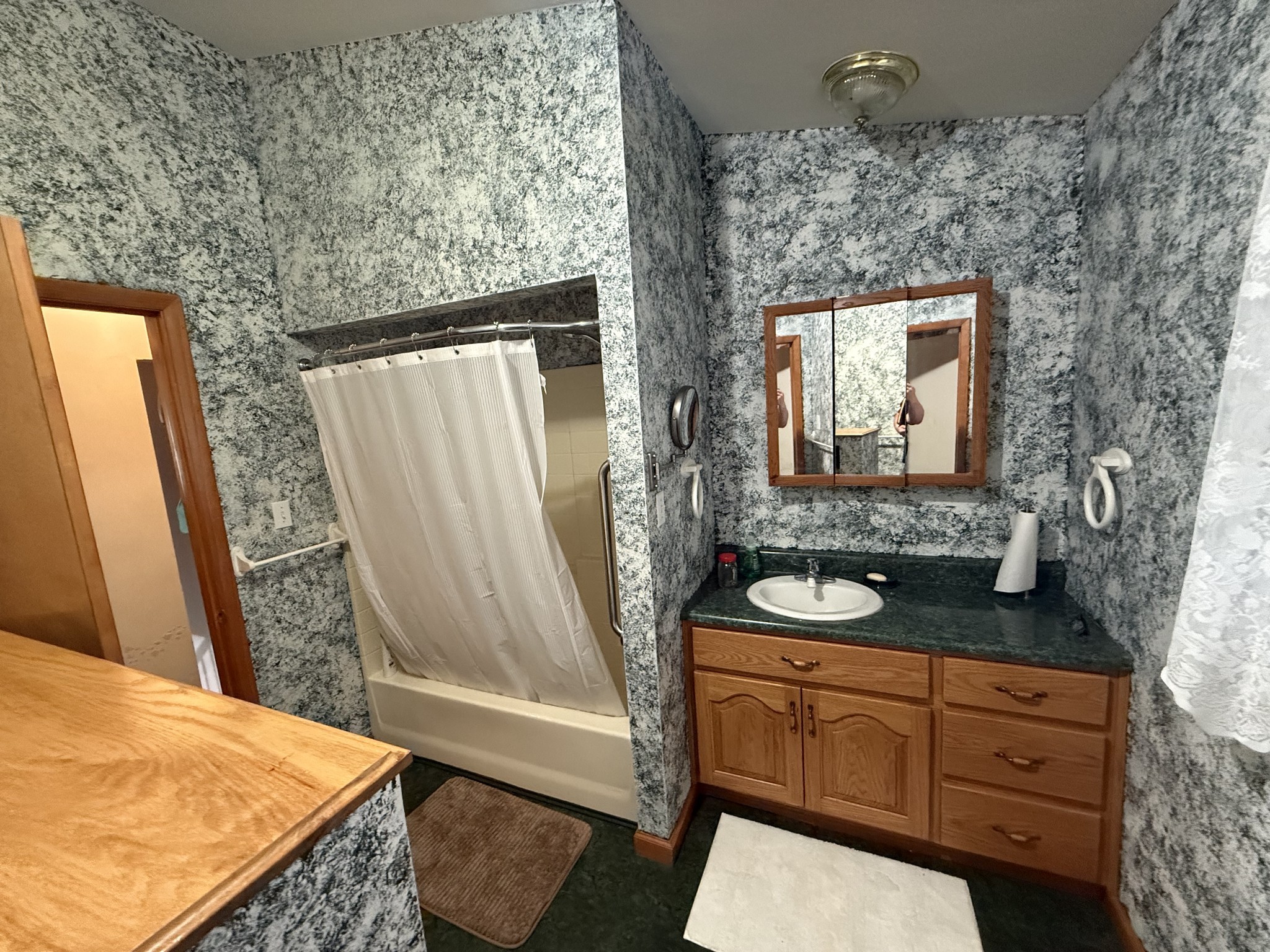 5 Carol Road Summertown, TN 38483 - Photo 29 of 60 a bathroom with a granite countertop sink a mirror and shower