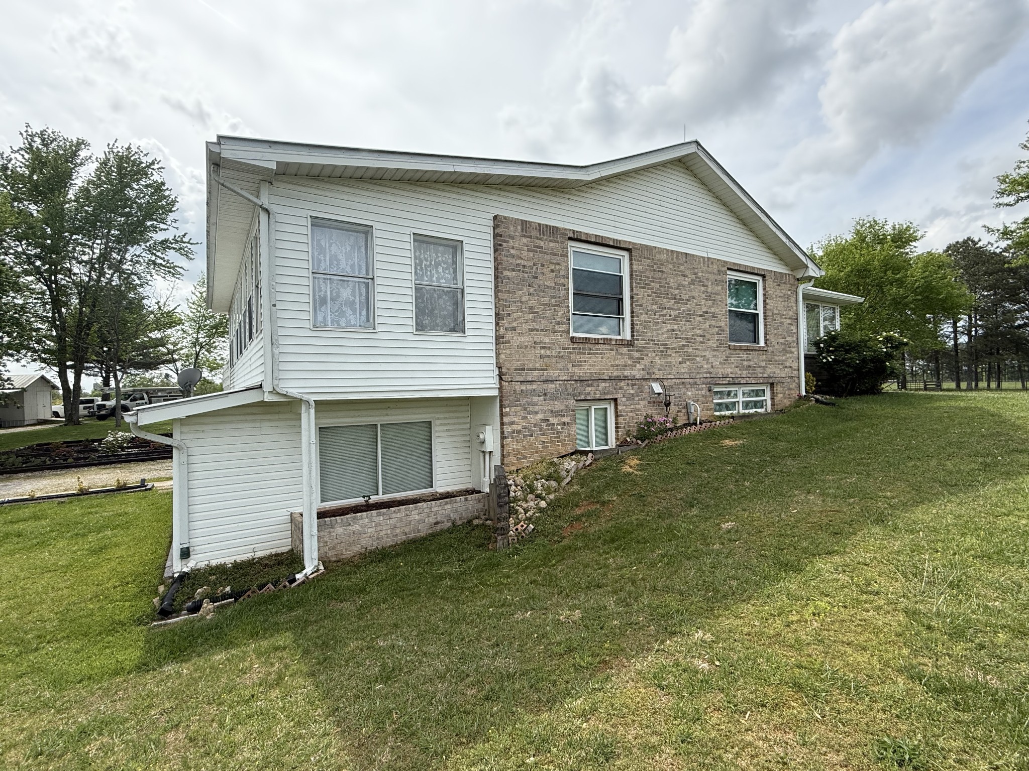 5 Carol Road Summertown, TN 38483 - Photo 48 of 60 a front view of house with yard and trees in the background