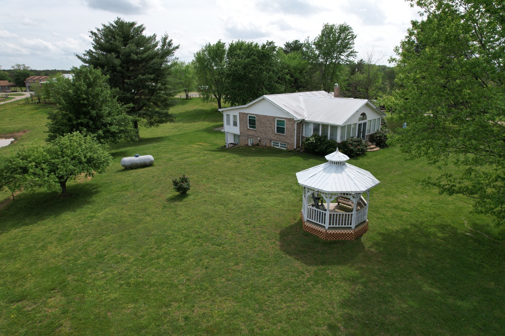 5 Carol Road Summertown, TN 38483 - Photo 5 of 60 a aerial view of a house with a yard table and chairs