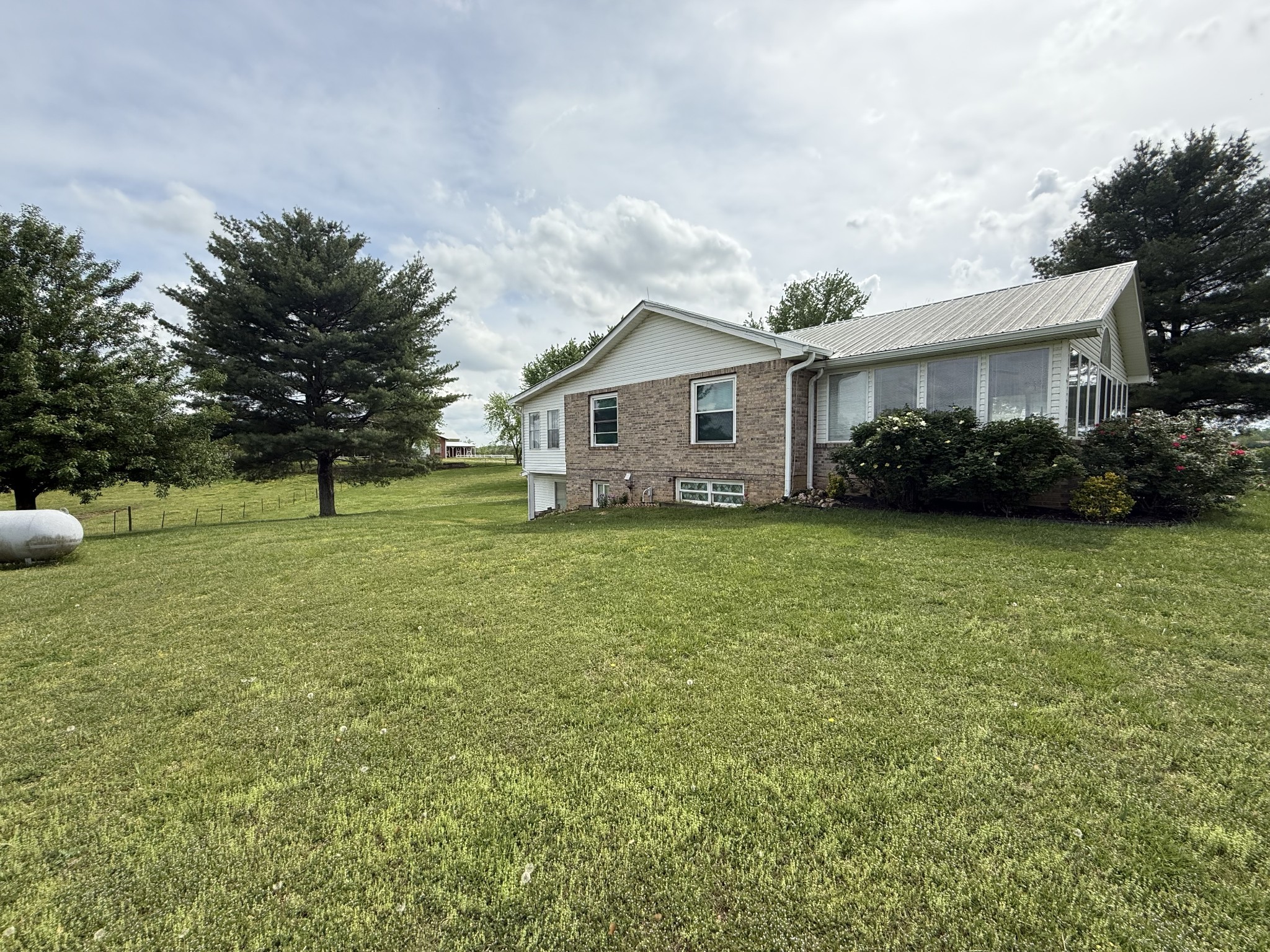 5 Carol Road Summertown, TN 38483 - Photo 53 of 60 a front view of a house with garden