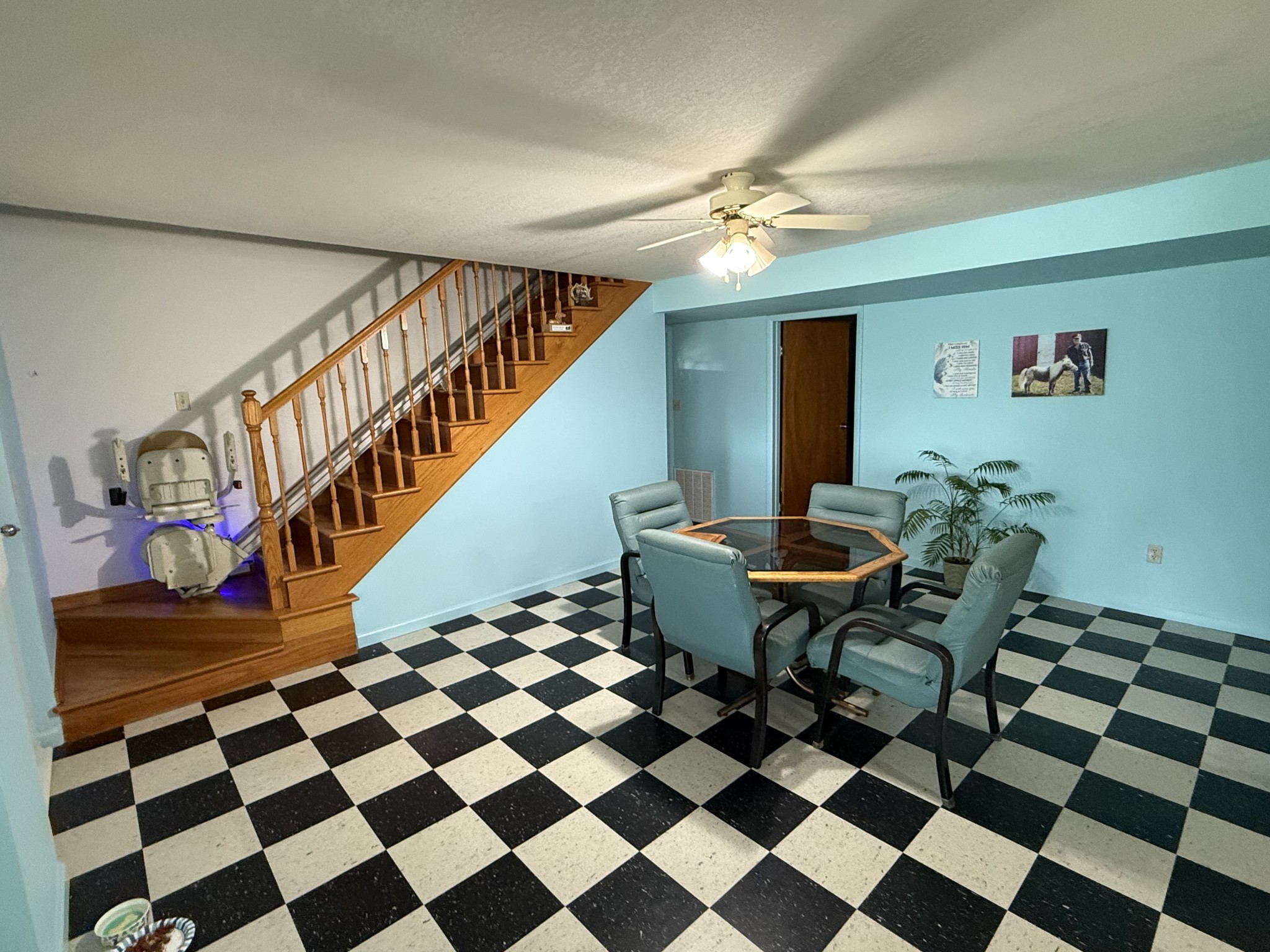 5 Carol Road Summertown, TN 38483 - Photo 10 of 60 a living room with a black white checkered floor with a gaming machine and dining table
