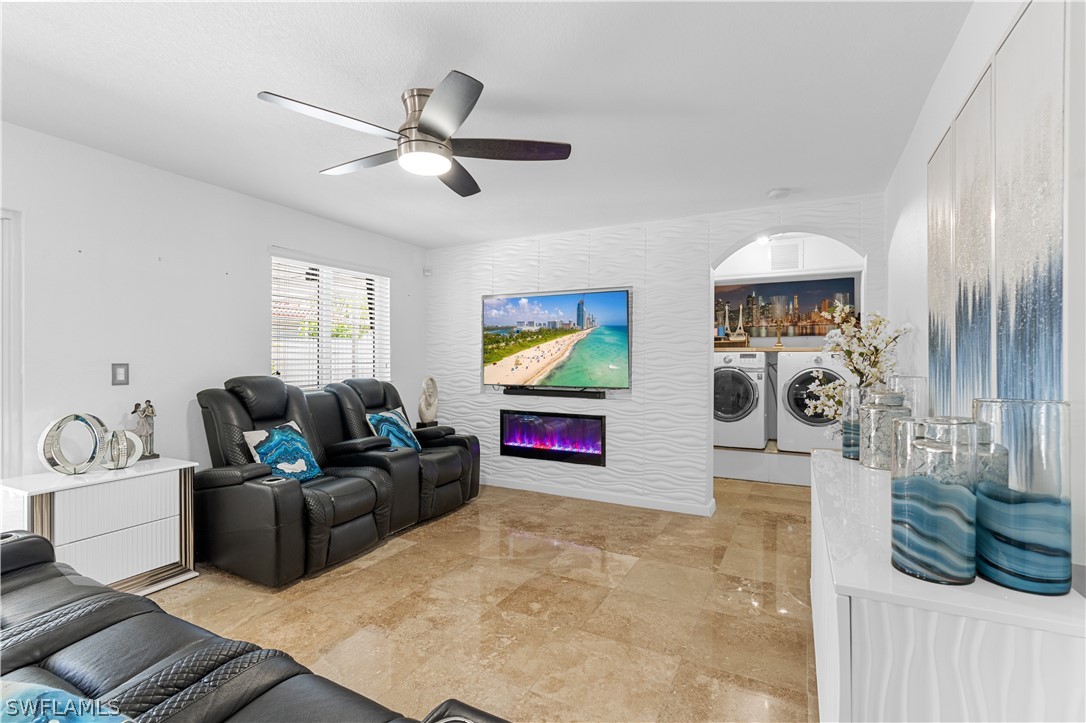 13302 Southwest 283rd Street Homestead, FL 33033 - Photo 11 of 43 a living room with furniture and a flat screen tv