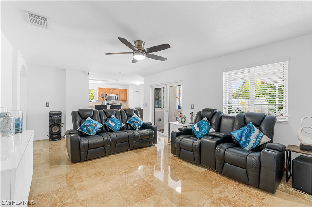 13302 Southwest 283rd Street Homestead, FL 33033 - Photo 13 of 43 a living room with furniture and a large window