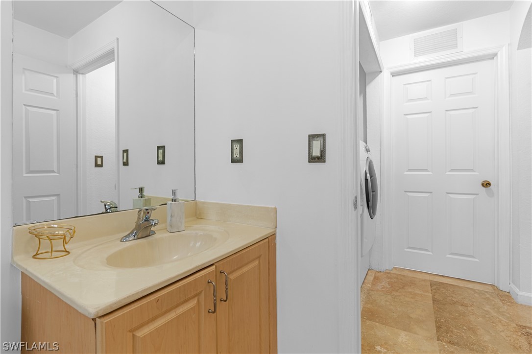 13302 Southwest 283rd Street Homestead, FL 33033 - Photo 16 of 43 a bathroom with a sink and a mirror