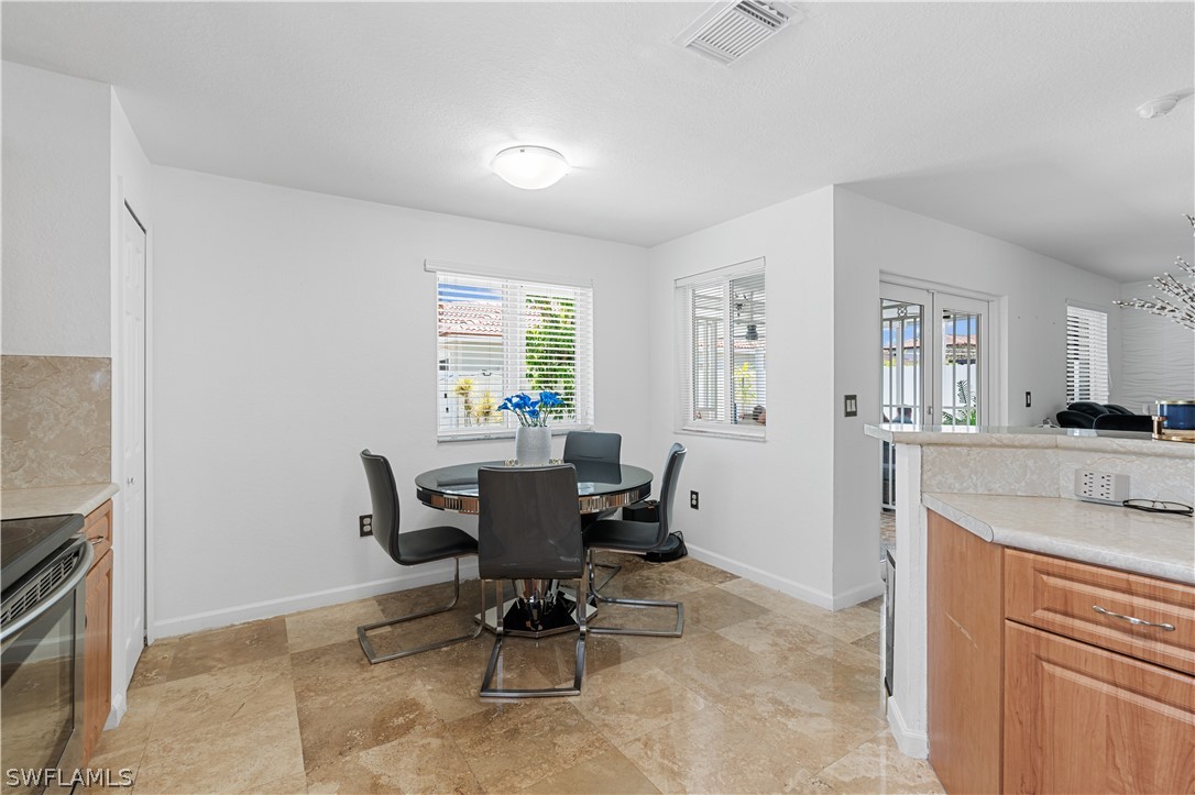 13302 Southwest 283rd Street Homestead, FL 33033 - Photo 21 of 43 a view of a dining room with furniture and a window