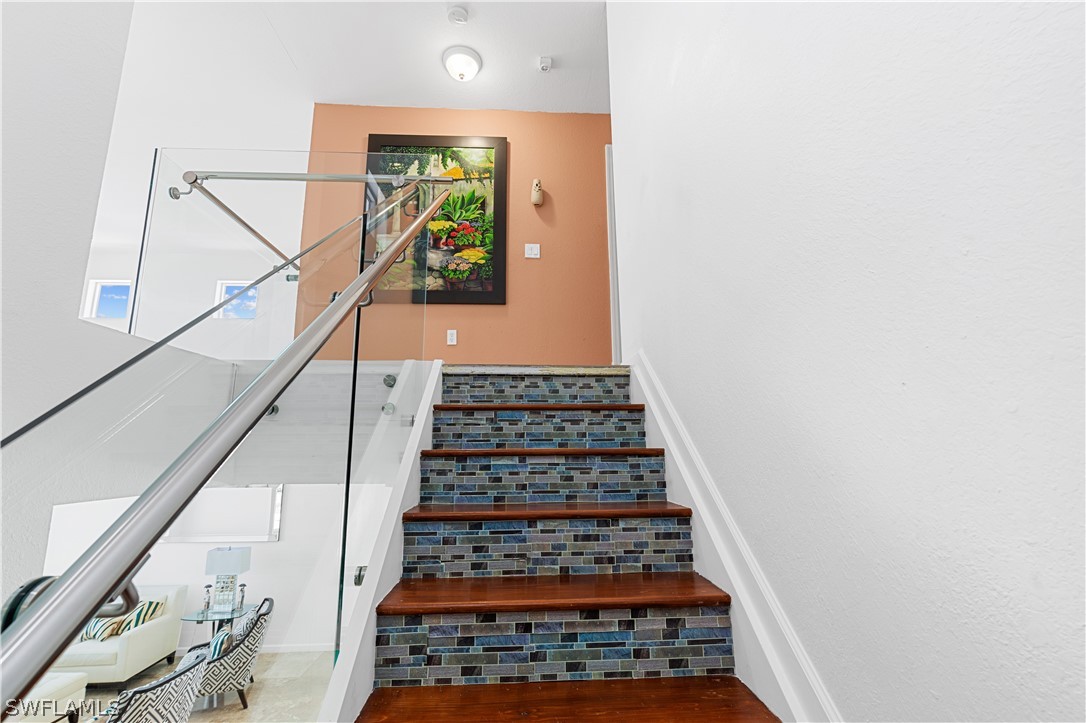13302 Southwest 283rd Street Homestead, FL 33033 - Photo 22 of 43 a view of staircase with wooden floor and white walls
