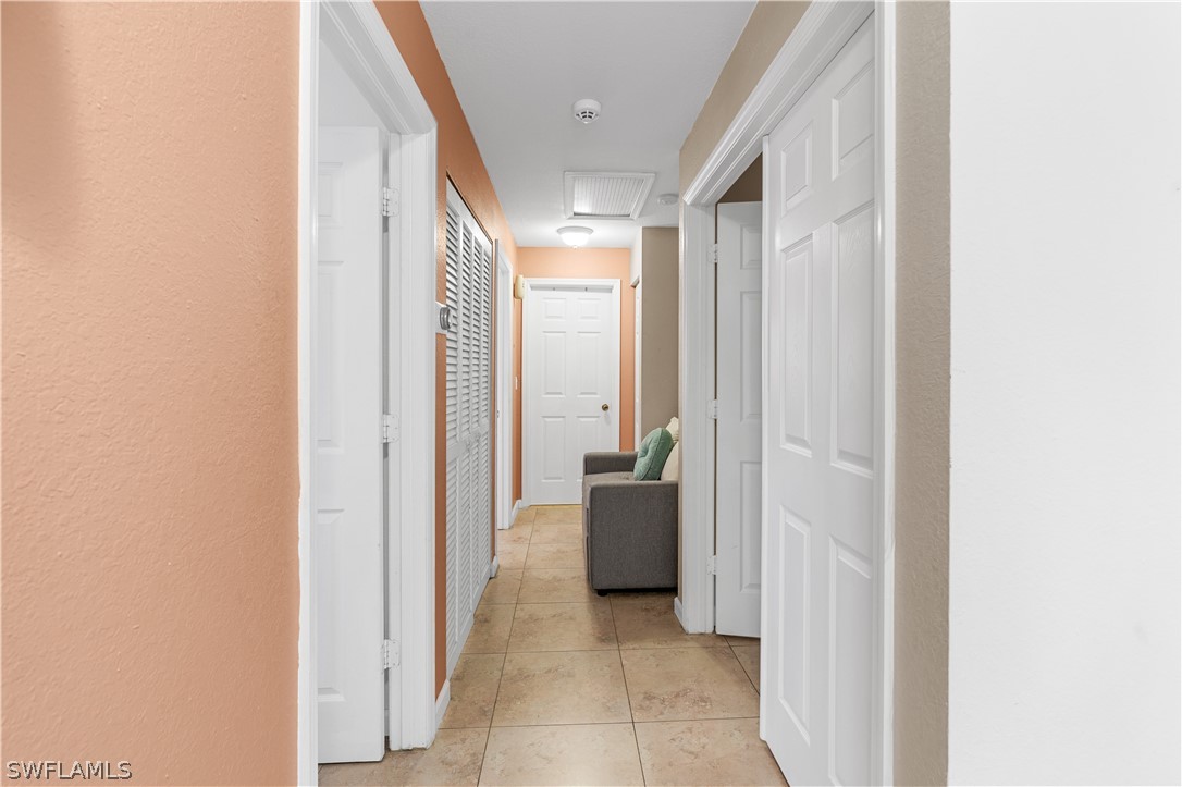 13302 Southwest 283rd Street Homestead, FL 33033 - Photo 24 of 43 a view of a hallway with furniture and front door