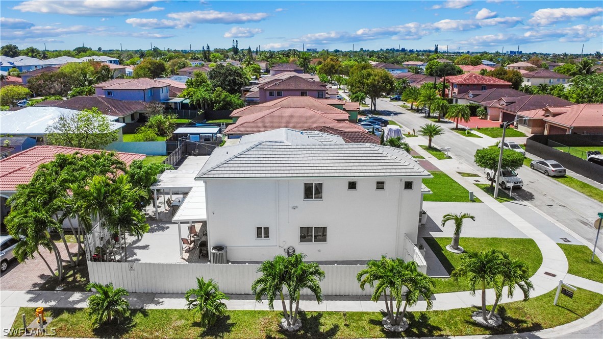 13302 Southwest 283rd Street Homestead, FL 33033 - Photo 3 of 43 an aerial view of a house with a yard and a pool
