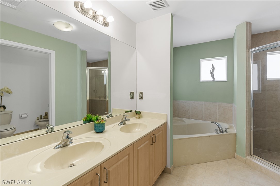 13302 Southwest 283rd Street Homestead, FL 33033 - Photo 31 of 43 a bathroom with a bathtub a sink and a mirror