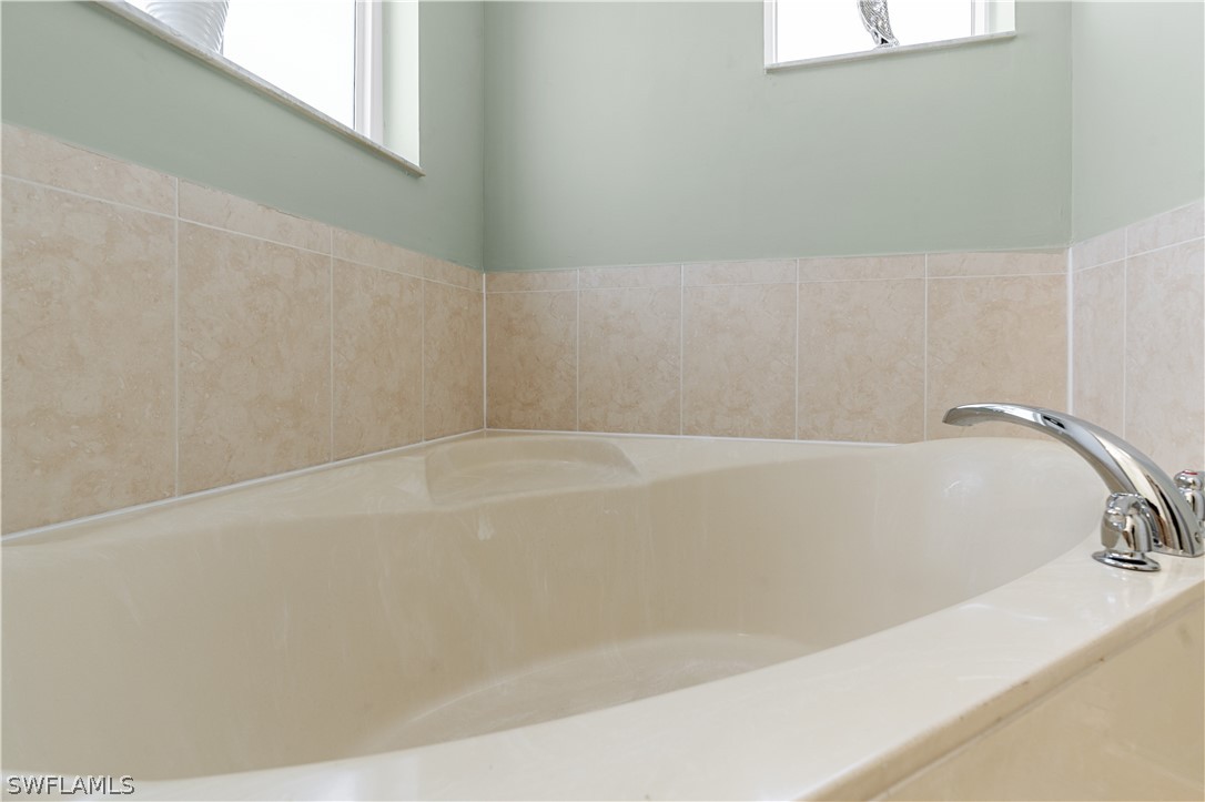 13302 Southwest 283rd Street Homestead, FL 33033 - Photo 33 of 43 a bathroom with a bathtub