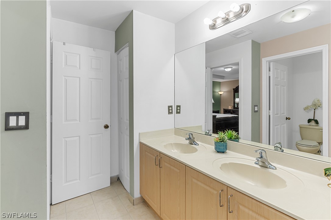 13302 Southwest 283rd Street Homestead, FL 33033 - Photo 35 of 43 a bathroom with 2 sink and a mirror